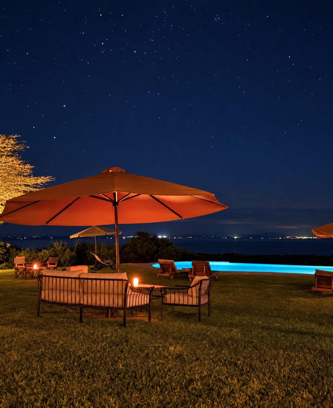 Lounge seating on the lawn under a night sky full of stars